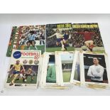 A collection of football trade cards and stickers