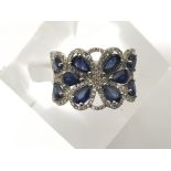 A good quality diamond and sapphire pierced band r