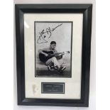 A signed and framed photograph of Hank Marvin.