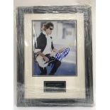 A signed and framed photograph of Keith Richards.