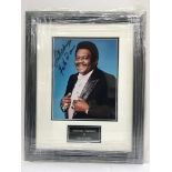 A signed and framed photograph of Fats Domino.