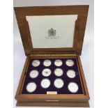 A cased set of 24 commemorative coins celebrating