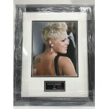 A signed and framed photograph of Pink.