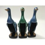 Theee Bakelite brushes in the form of ducks.