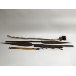 A collection of tribal items including two spears