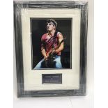 A framed and signed photograph of Bruce Springstee