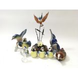 A collection of bird figures to include Swarovski, Goebel and Copenhagen.