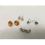 4 pairs of Swarovski earrings.