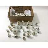 A small box of assorted crested china