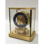 A Jaeger LeCoultre atmos clock with blue marbled d