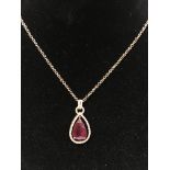 A lovely 14 ct rose gold diamond and ruby necklace