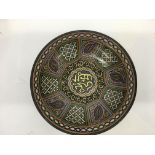 A large bowl decorated with oriental patterns