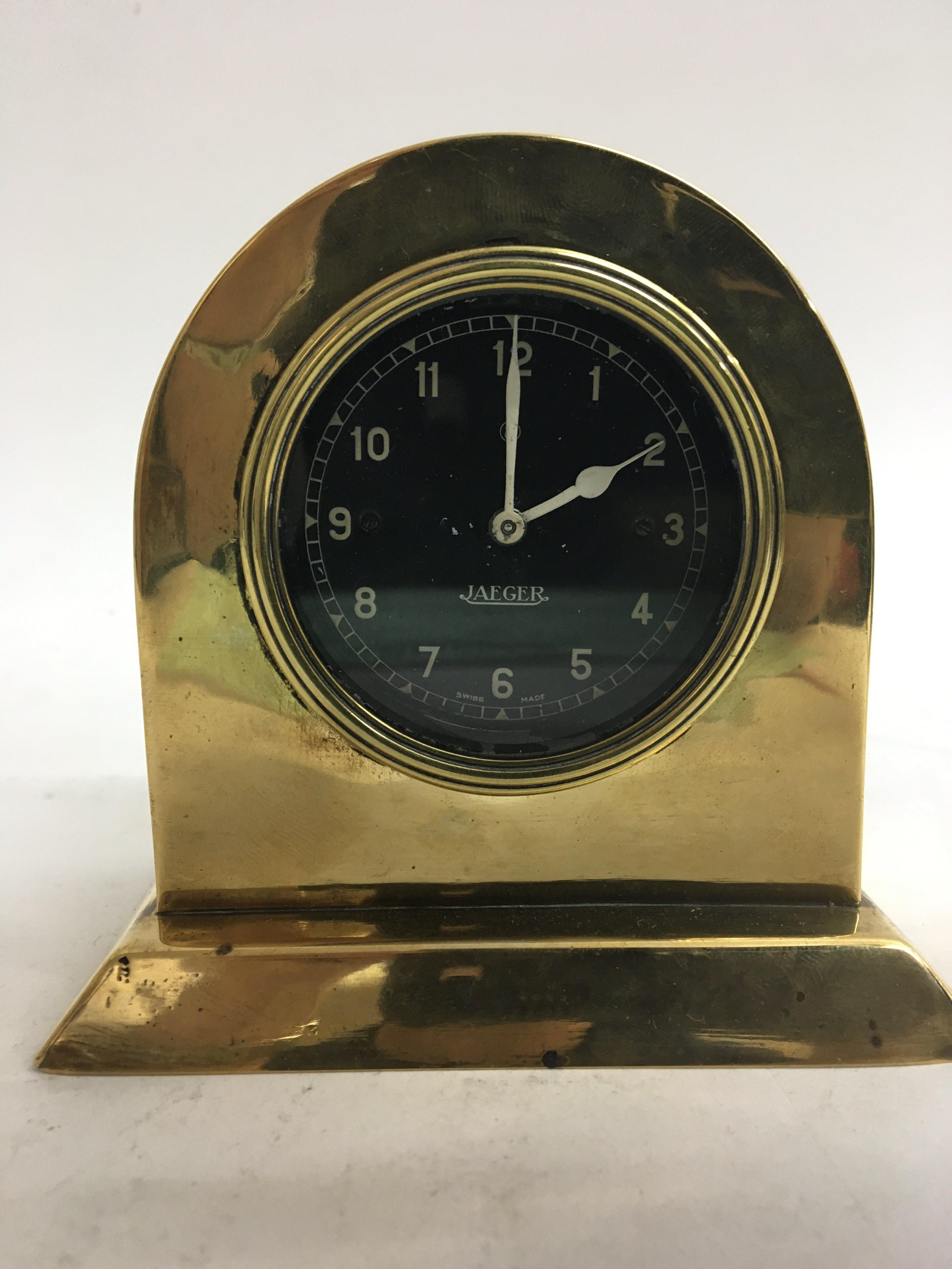 An unusual Jaeger car clock in a brass case (worki