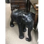 A large leather free standing elephant with simula