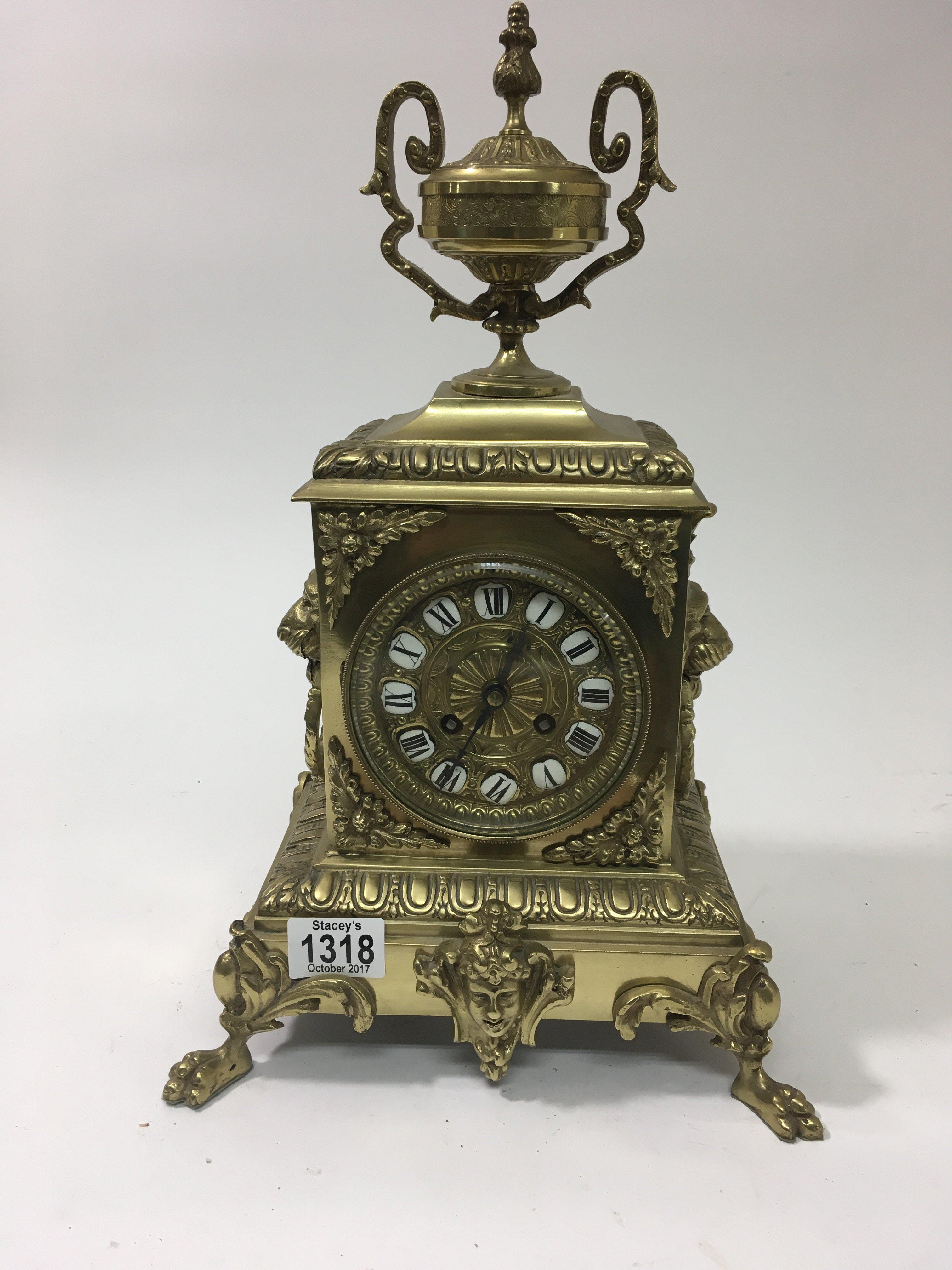 An Victorian gilt metal clock of classic style the