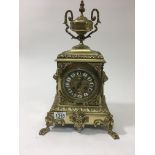 An Victorian gilt metal clock of classic style the