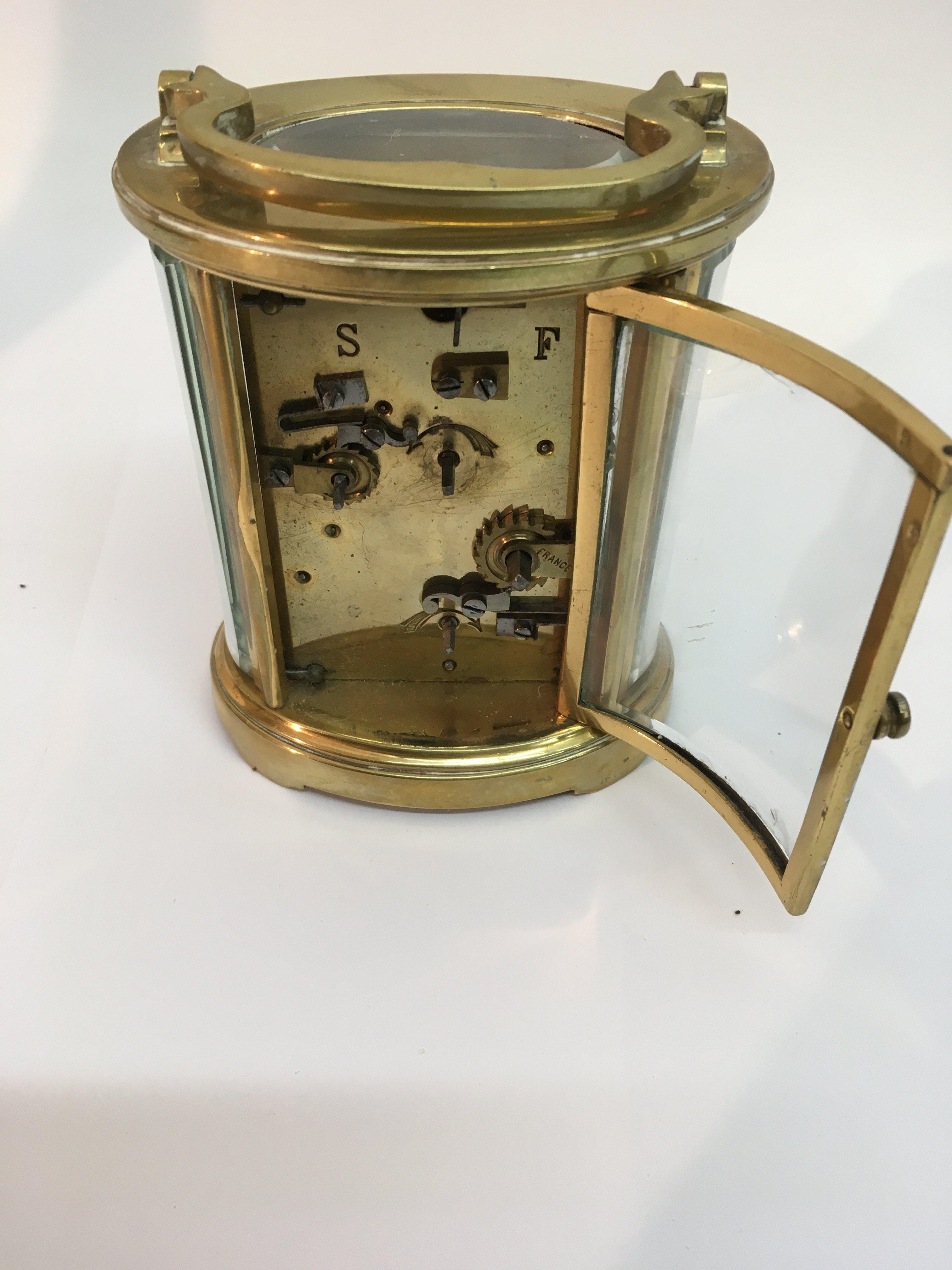 A brass oval carriage clock the enamel dial with A - Image 2 of 2