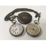 Two silver pocket watches and a silver vesta case