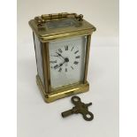 A brass cased French carriage clock.