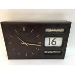 A retro English Clock Systems wall clock with cale