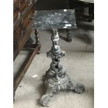 A cast iron late 19th Century table, with an ornat