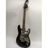 A Fender Squier Stratocaster guitar in black with