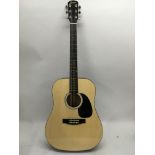 A Fender Squier acoustic guitar, model number 093-