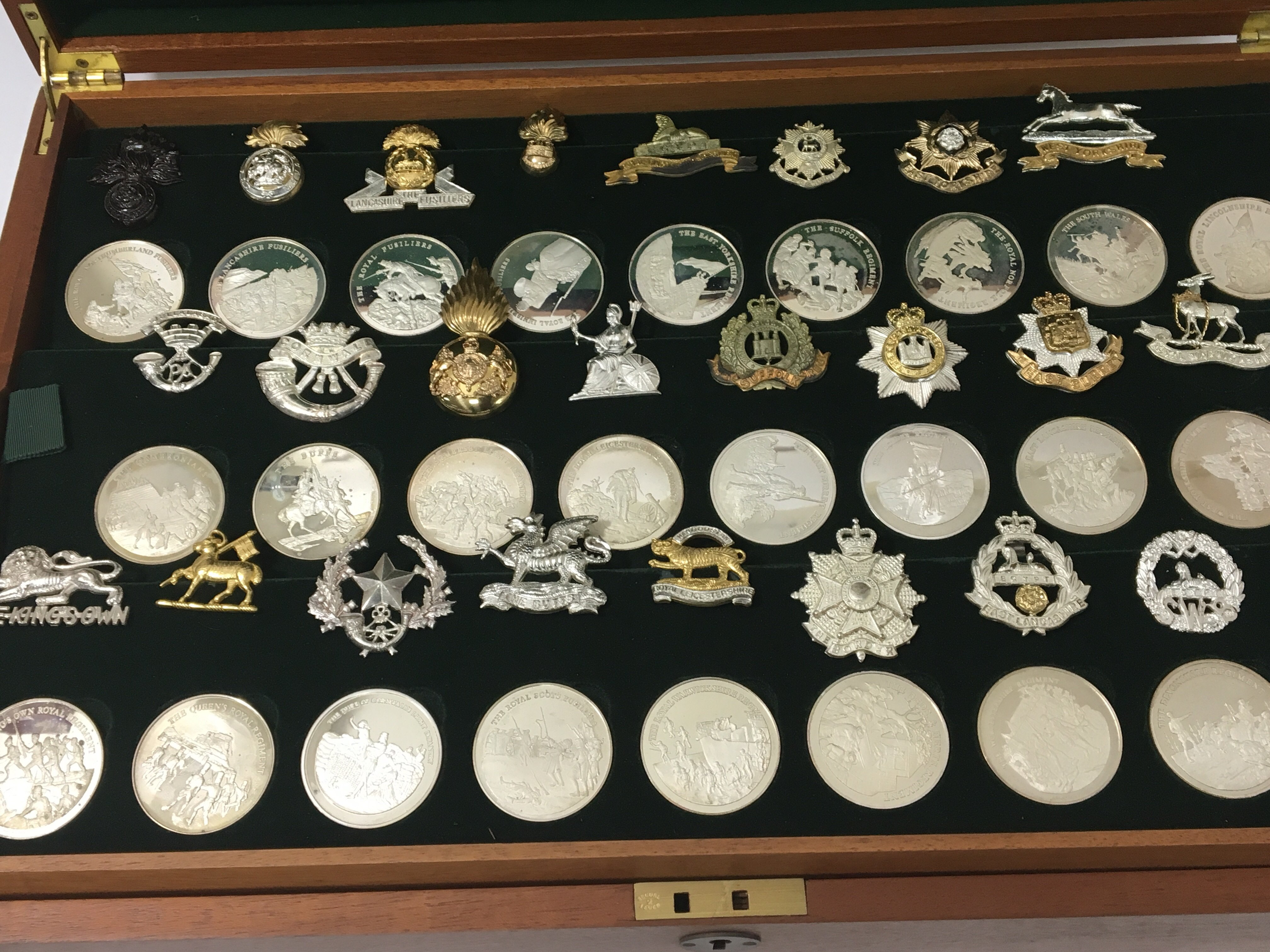 A collection of twenty five silver medallions dipi