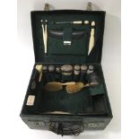 An antique ladies crocodile vanity case containing