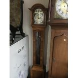 A modern yew wood long case clock.