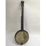 A banjo with mother of pearl dot inlays.