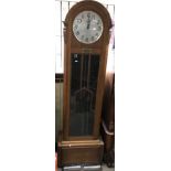 An Art Deco oak longcase clock with weights and pe