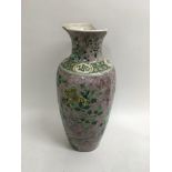 A 19th Century Chinese vase painted with flowers a
