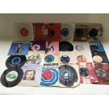 A collection of 7 inch singles by various artists