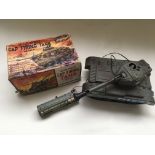 A boxed battery operated cap firing tank by Marx t