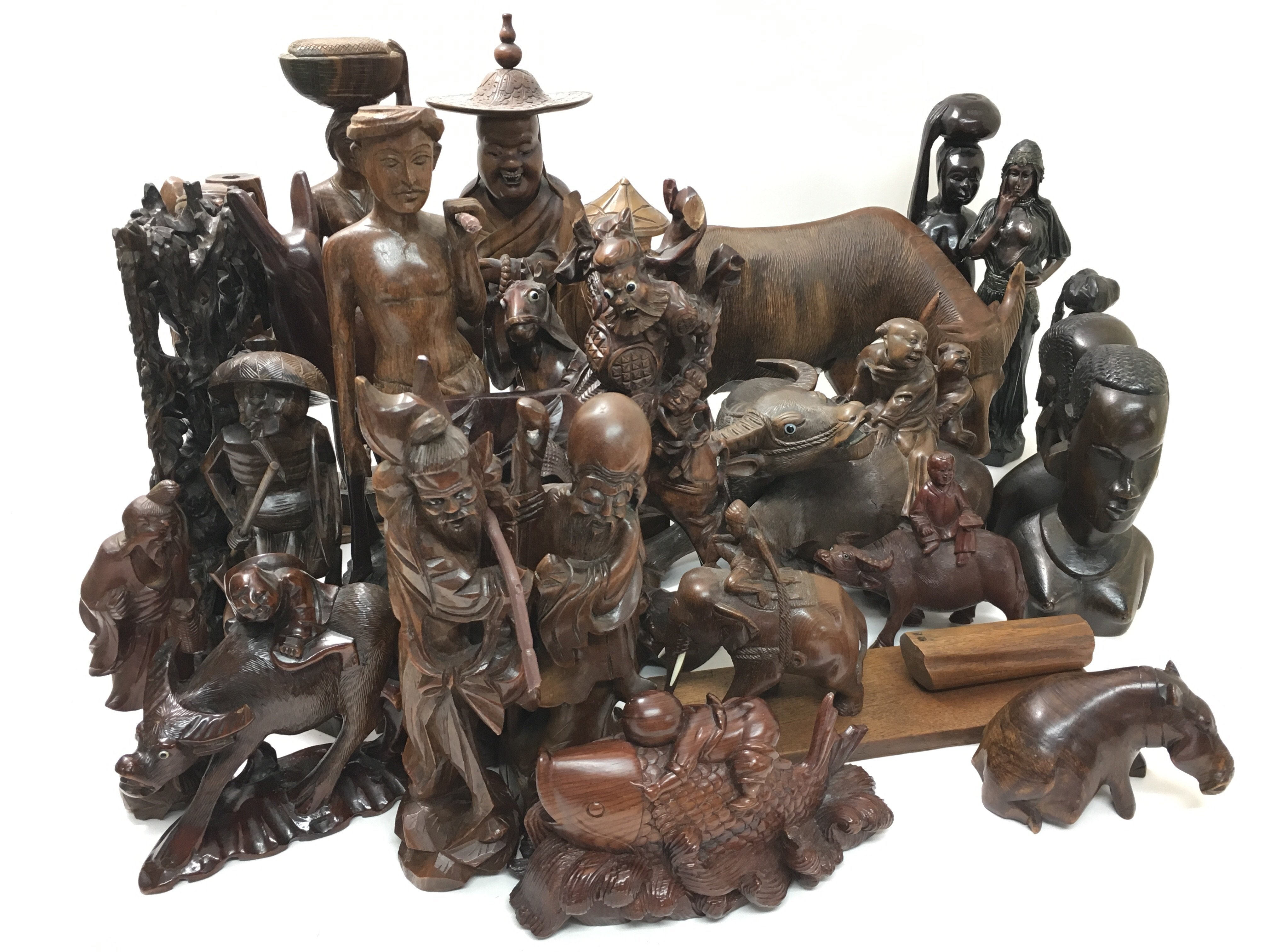 An extensive collection of carved hardwood figures