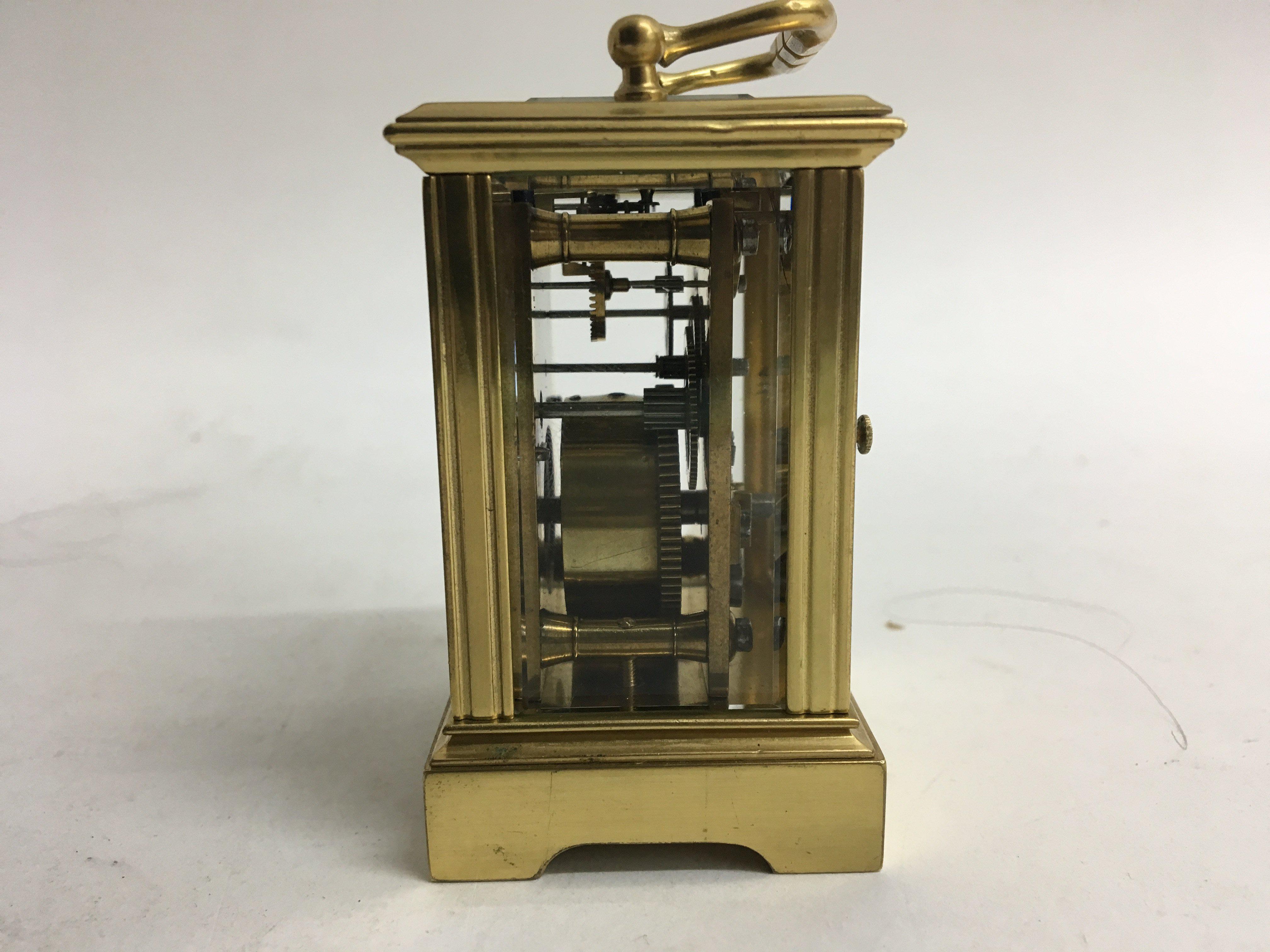 A miniature brass carriage clock. - Image 3 of 4