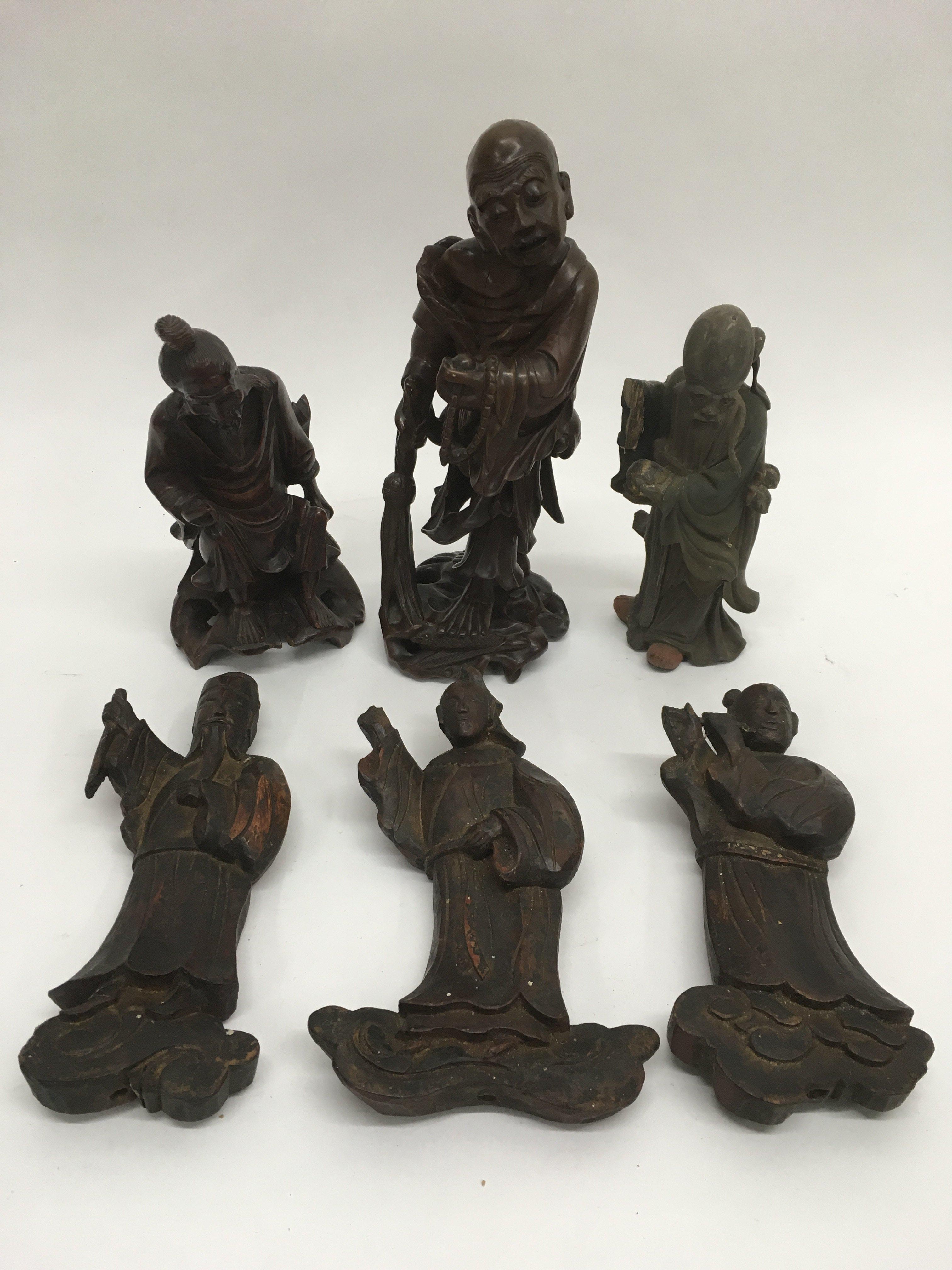 Six carved wooden oriental figures of deitys, elde