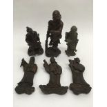 Six carved wooden oriental figures of deitys, elde