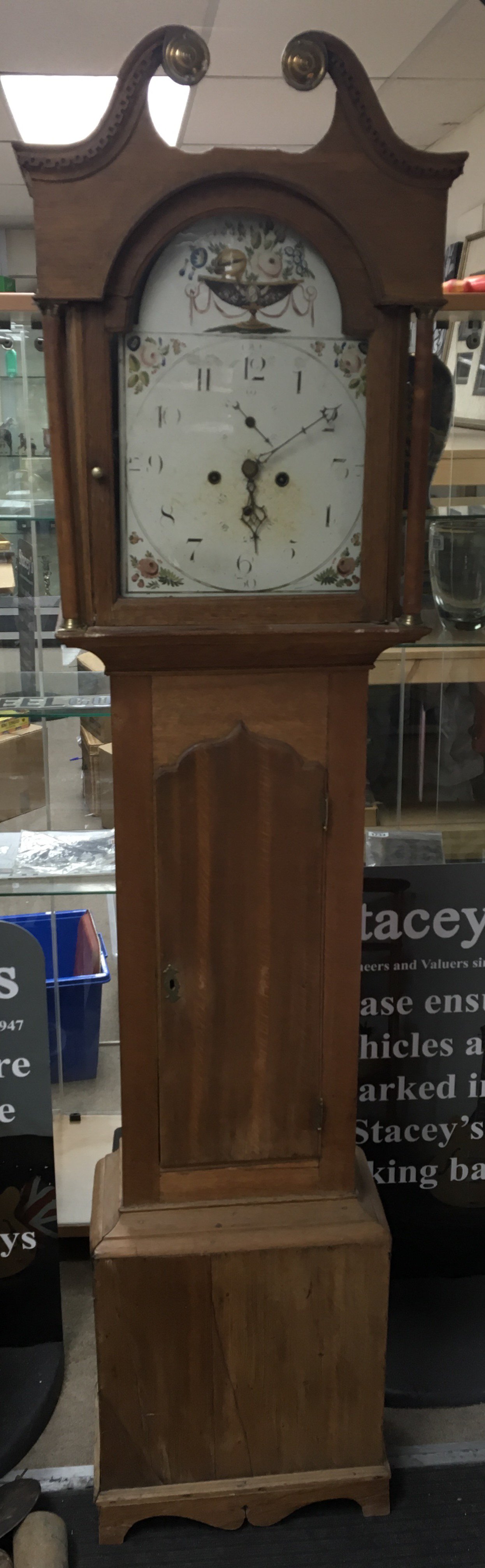 An oak long cased clock with unsigned painted dial