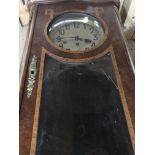 A French walnut wall clock with applied gilt metal