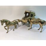 A brass orderment in the form of a horse and carri