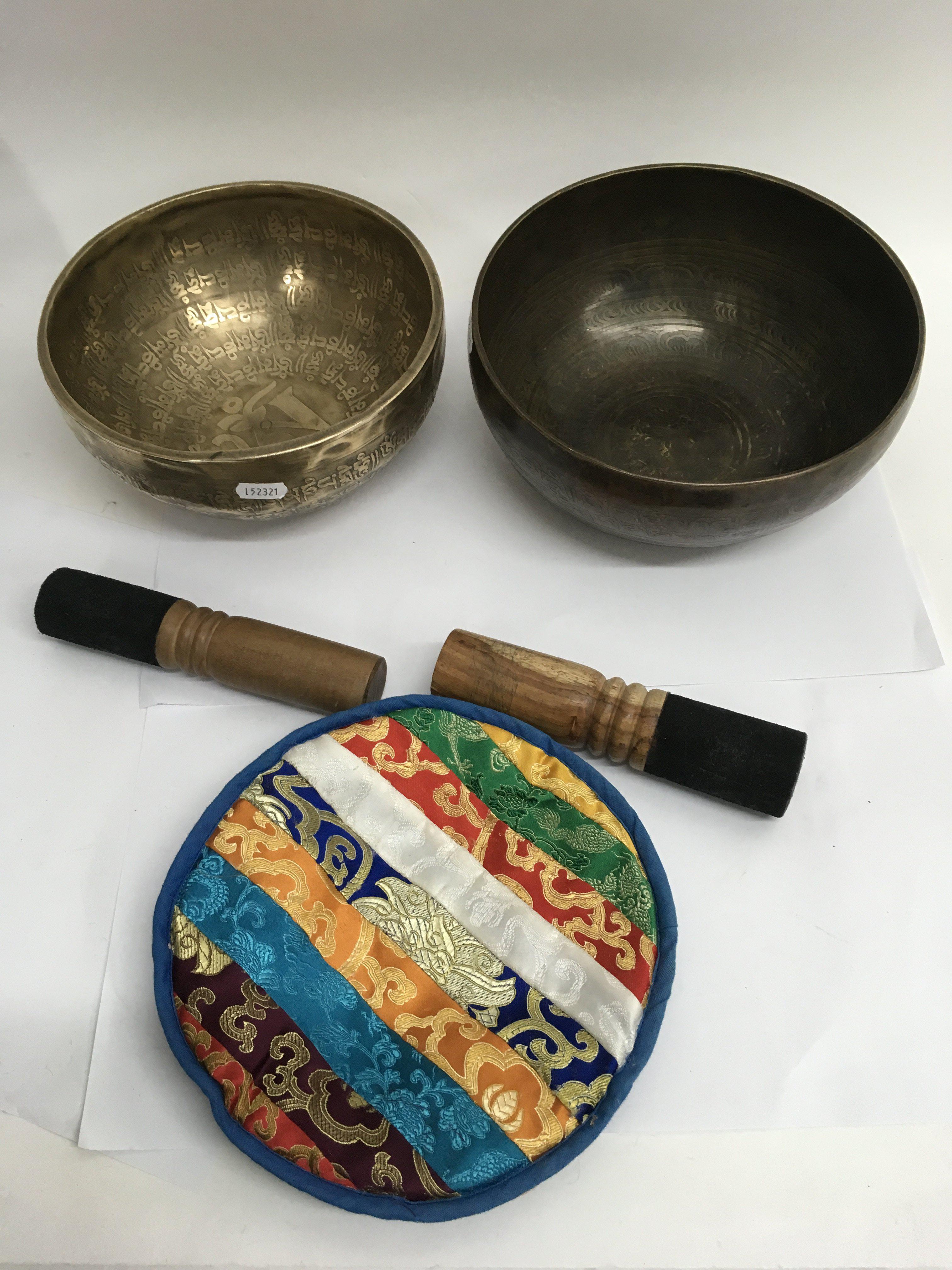 Two Tibetan singing bowls.