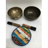 Two Tibetan singing bowls.