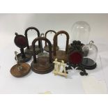 A collection of open pocket watch stands,