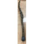 A root carved walking staff