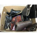 A collection of antique shoes and boots including