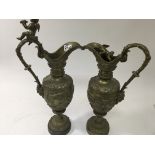 A pair of gilt bronzed Ewers of classical form the