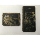 Two Japanese cigarette cases decorated with typica