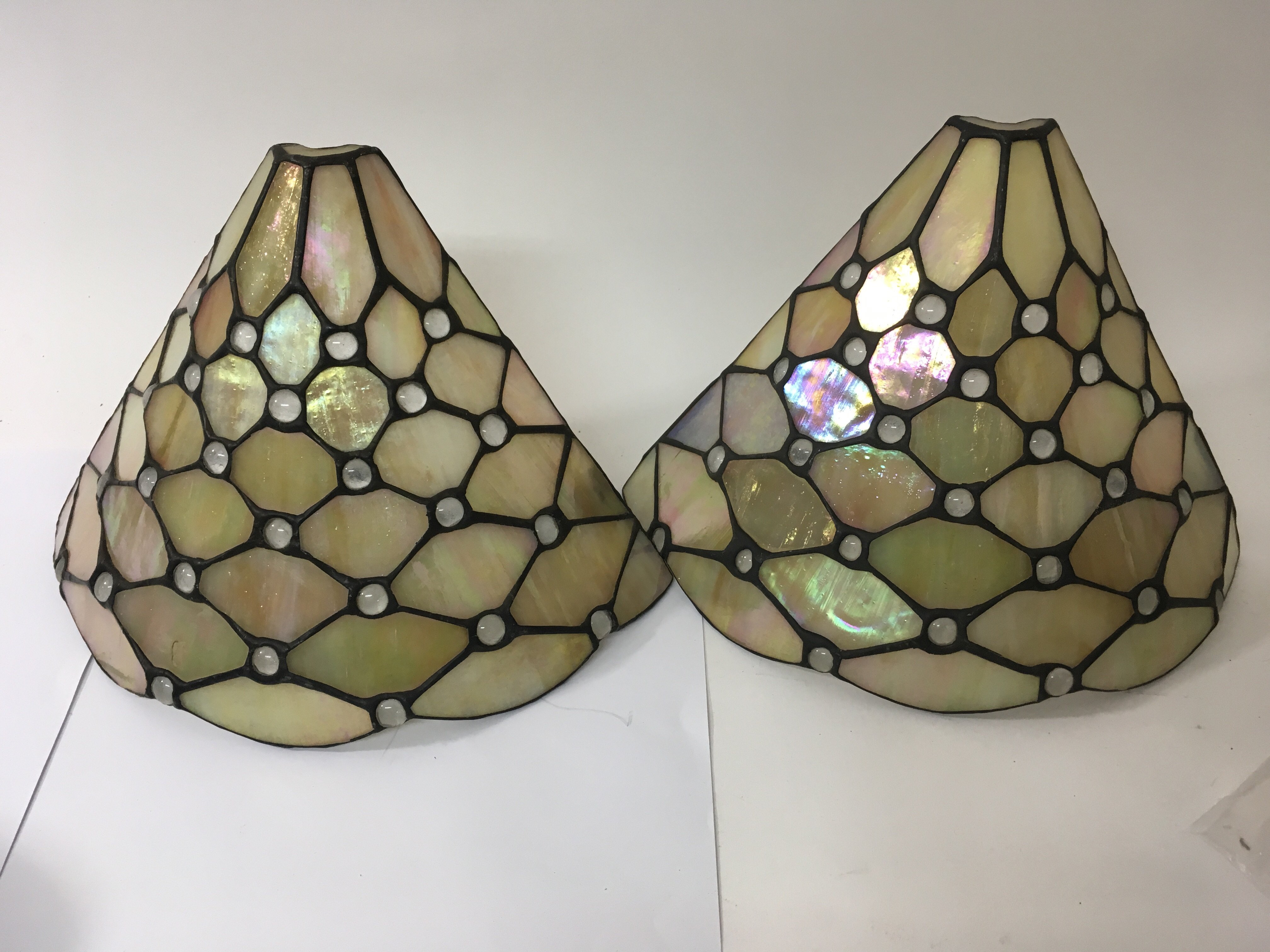 A Tiffany style ceiling light and two wall lights.